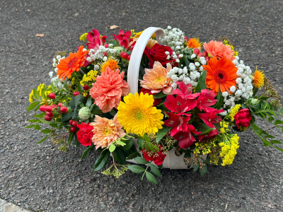 Autumn Hedgerow Basket - A collection of seasonal flowers and foliage arranged in a natural basket.
