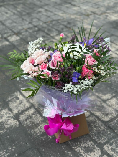 Blush & Berry Garden - A beautifully balanced bouquet featuring soft blush pinks, delicate whites, and pops of rich purple nestled among fresh, flowing greenery. Designed in a loose, natural style, this arrangement has a light and airy feel with plenty of texture and movement. Finished with elegant wrap and a vibrant ribbon, it’s perfect for romantic gestures, celebrations, or sending a thoughtful and stylish gift.
